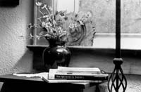 Vase, flowers, books