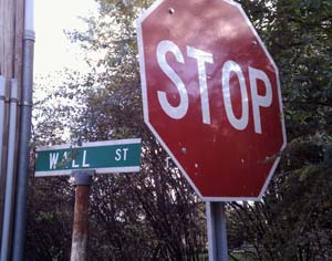 Stop sign next to sign for Wall Street, Cold Spring, NY
