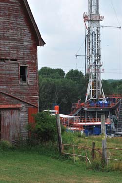 Drilling well next to barn